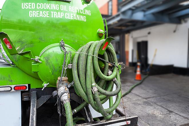 a service truck pumping grease from a restaurant's grease trap in Calipatria, CA